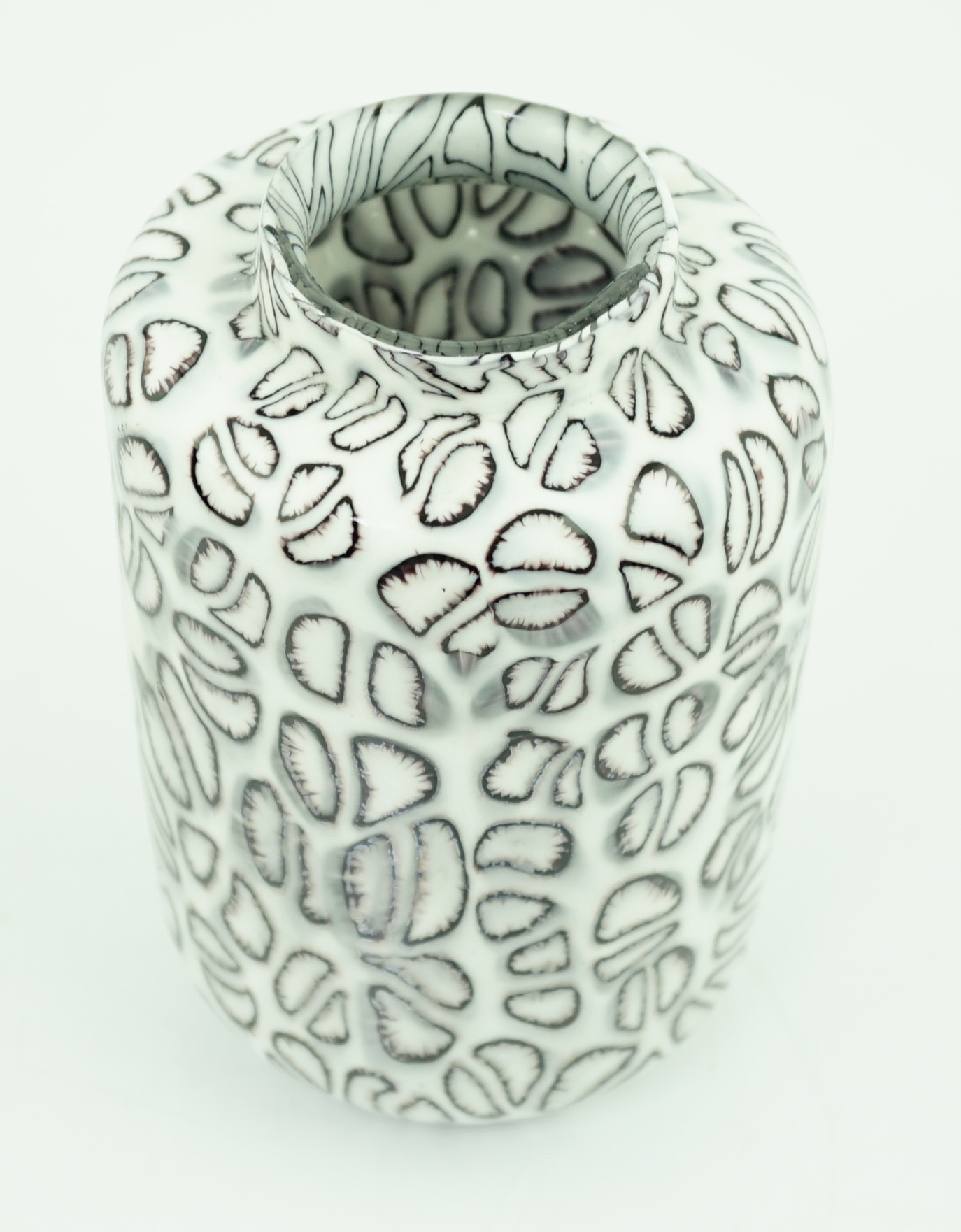 Vittorio Ferro (1932-2012) A Murano glass Murrine vase, with black segments on a white ground, signed, 17cm, Please note this lot attracts an additional import tax of 20% on the hammer price